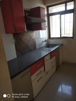 Kitchen in 1 BHK Apartment at KM Horizon Flora, Ghodbunder Road – for Sale