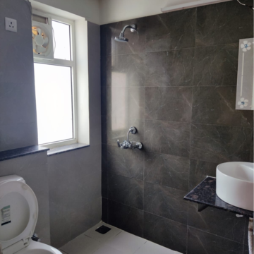 Bathroom in 3 BHK Apartment at International Airport Road – for Rent