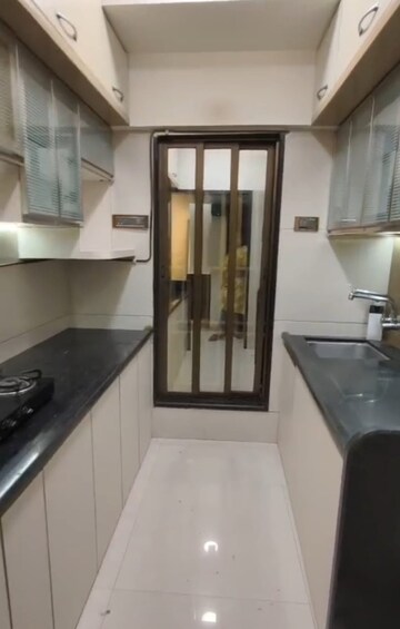 Kitchen in 2 BHK Apartment at Kalpataru Siddhachal Elite, Vasant Vihar – for Rent