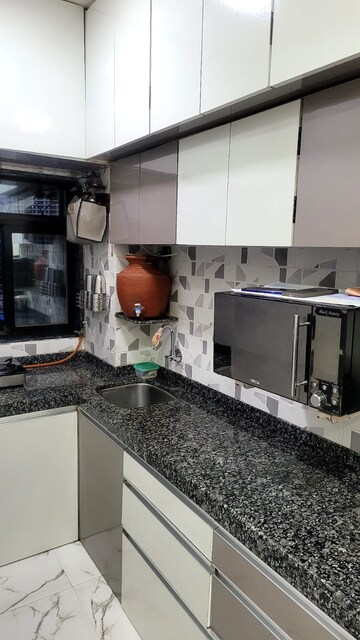 Kitchen in 2 BHK Apartment at Devratna Nagar CHS, Chunabhatti – for Sale