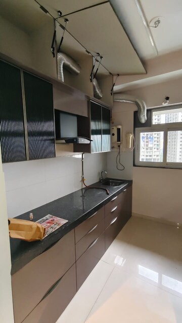 Kitchen in 2 BHK Apartment at Ashar Axis, Majiwada – for Rent