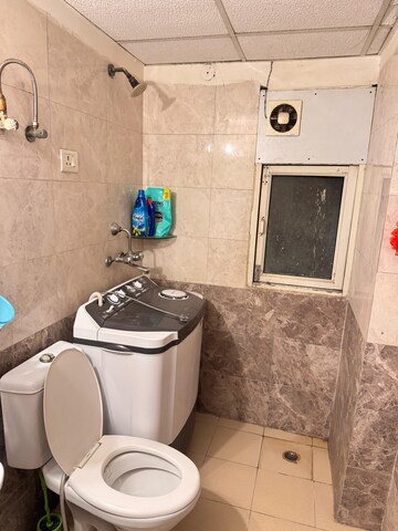 Laundry Area in 2 BHK Apartment at Aims Golf City, Sector 75 – for Rent