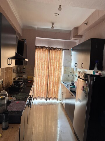 Kitchen in 2 BHK Apartment at Aims Golf City, Sector 75 – for Rent