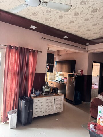 Living Room in 2 BHK Apartment at Aims Golf City, Sector 75 – for Rent