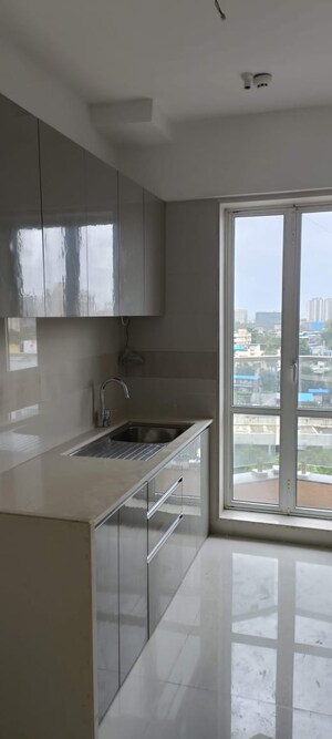 Kitchen in 4 BHK Apartment at Crystal Garden Estate CHS, Manpada – for Sale