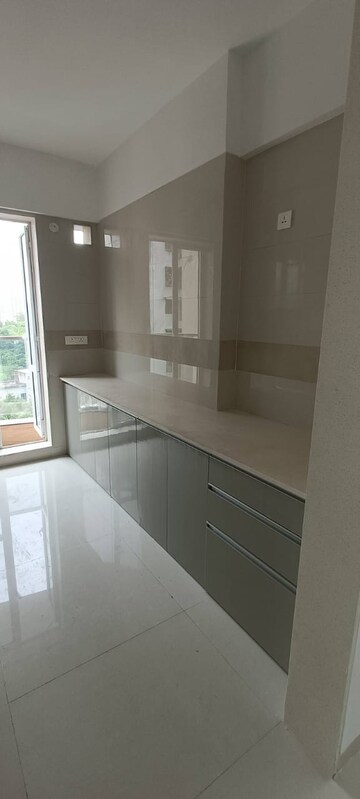 Kitchen in 4 BHK Apartment at Crystal Garden Estate CHS, Manpada – for Sale