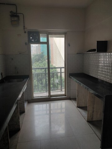 Kitchen in 2.5 BHK Apartment at Rosa Gardenia, Ghodbunder Road – for Rent