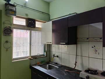 Kitchen in 1 BHK Apartment at Srushti Apartments, Ghodbunder Road – for Rent