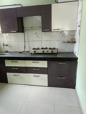 Kitchen in 1 BHK Apartment at Srushti Apartments, Ghodbunder Road – for Rent