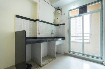 Kitchen in 1 BHK Apartment at Mahavir Kalpavruksha, Ghodbunder Road – for Sale