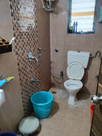 Bathroom in 2 BHK Apartment at KM Horizon Flora, Ghodbunder Road – for Rent