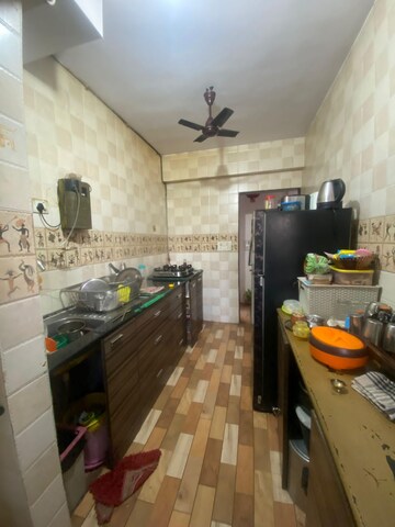 Kitchen in 2 BHK Apartment at Hiranandani Estate Carrara, Ghodbunder Road – for Sale