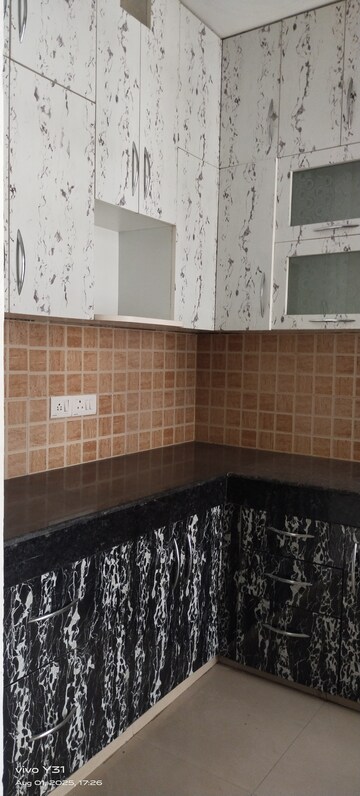 Kitchen in 2 BHK Apartment at Mahagun Mywoods III, Sector 16c Greater Noida – for Rent