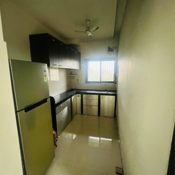 Kitchen in 1 BHK Apartment at Eden Woods complex, Manpada – for Rent
