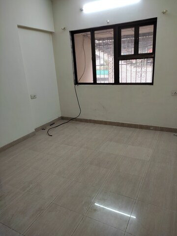 Master Bedroom in 1 BHK Apartment at Sonal Link Residency, Malad West – for Rent