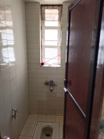 Bathroom in 1 BHK Apartment at New Gitanjali CHS, Malad East – for Rent