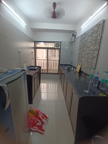 Kitchen in 2 BHK Apartment at Ninaad CHS, Malad West – for Rent