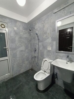 Bathroom in 3 BHK Apartment at Orchid Petals, Sector 49 – for Sale