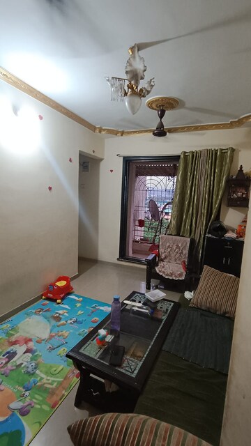 Living Room in 1 BHK Apartment at Kopar Khairane – for Sale