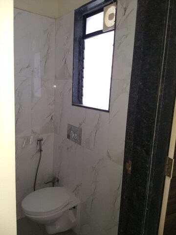 Bathroom in 1 BHK Apartment at Dosti Desire, Brahmand – for Sale