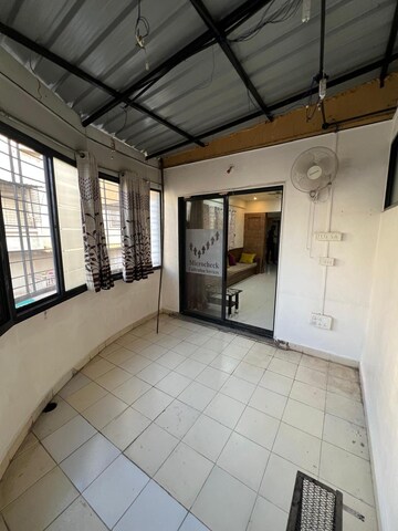 Living Room in 2 BHK Apartment at Bhosle Garden CHS, Hadapsar – for Rent