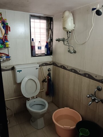 Bathroom in 1 BHK Apartment at Liberty Corner CHS, Mira Road – for Rent