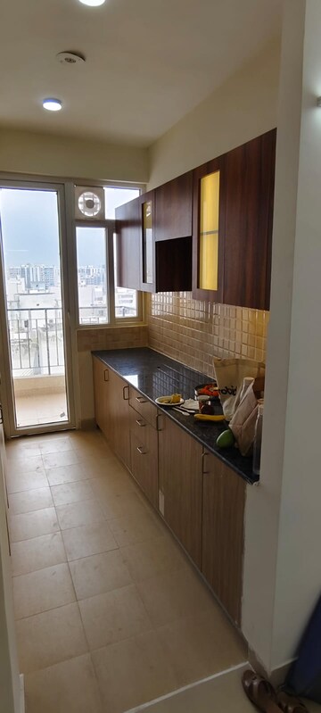 Kitchen in 3 BHK Apartment at Amrapali Crystal Homes, Sector 76 – for Rent