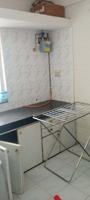 Kitchen in 1 BHK Apartment at Takshila CHS, Andheri East – for Sale