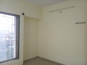 Room in 2 BHK Apartment at Om Golden Palms, Wakad – for Sale