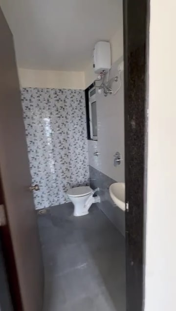 Bathroom in 2 BHK Apartment at Raunak Unnathi Greens, Kasarvadavali – for Rent