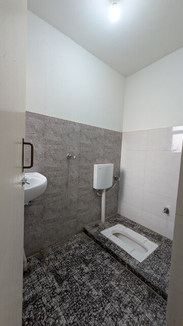 Bathroom in 1 BHK Apartment at Aditya Vrinda Homes Phase 2, Shahpur Bamheta – for Rent