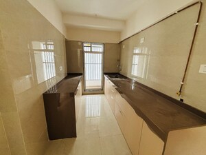 Kitchen in 2 BHK Apartment at Je and Vee Madhuban, Malad East – for Sale