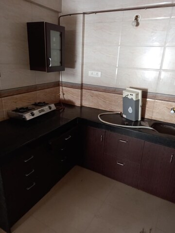 Kitchen in 2 BHK Apartment at Yash Wisteria, Wakad – for Rent