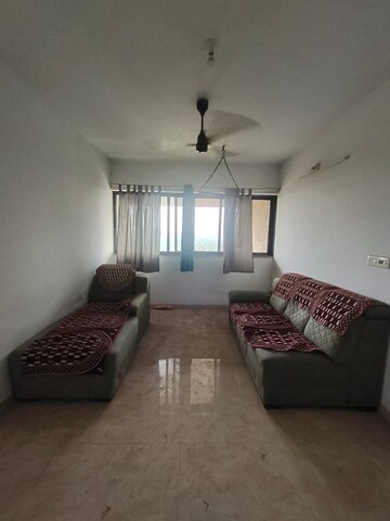 Living Room in 2.5 BHK Apartment at Lodha Lakeshore Greens, Dombivli East – for Rent