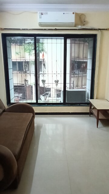 Living Room in 1 BHK Apartment at Shruti CHS, Kandivali West – for Rent