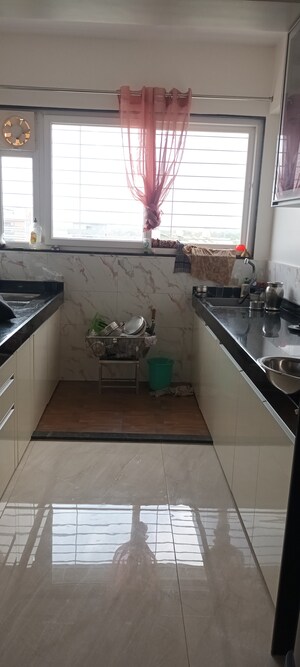 Kitchen in 2 BHK Apartment at D And T Rajkamal Park CHS, Aundh – for Sale