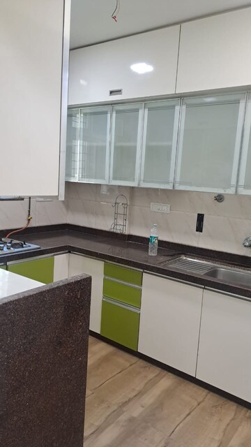 Kitchen in 3 BHK Apartment at Hiranandani Estate Penrose, Thane West – for Rent