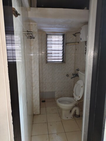 Bathroom in 1 BHK Apartment at Dheeraj Uphar CHS. LTD., Malad East – for Rent