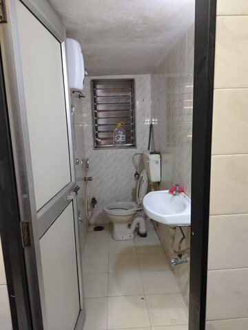 Bathroom in 1 BHK Apartment at Dheeraj Uphar CHS. LTD., Malad East – for Rent