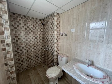Bathroom in 3 BHK Apartment at Mahagun Mantra I, Sector 10 Greater Noida – for Rent