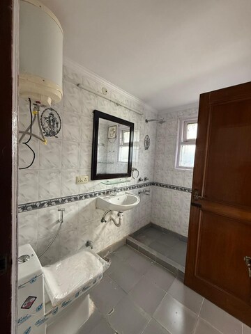 Bathroom in 3 BHK Builder Floor at Nehru Enclave – for Rent
