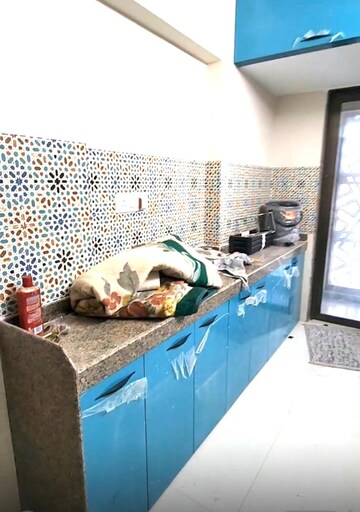 Kitchen in 2 BHK Apartment at Rassaz Greens Tower C D and E, Mira Road – for Rent