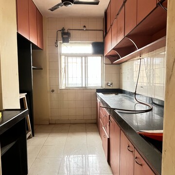 Kitchen in 2 BHK Apartment at New Brahmand Phase 7 CHS, Kiran Mill Colony – for Sale