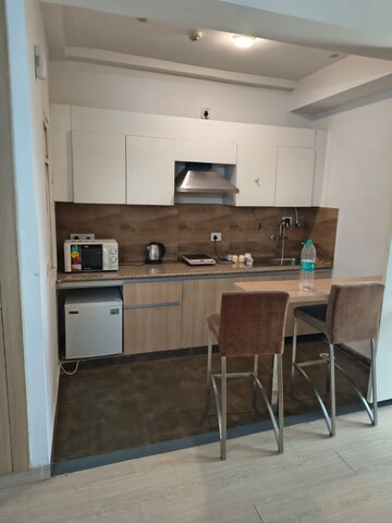 Kitchen in 1 RK Apartment at Nimbus The Golden Palm, Sector 168 – for Rent