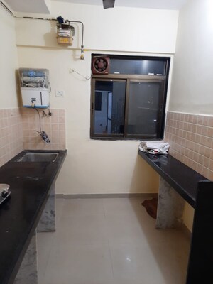 Kitchen in 1.5 BHK Apartment at Green Square, Kasarvadavali – for Sale