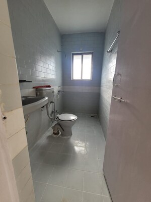 Bathroom in 2 BHK Apartment at Simran Orchid, Salunkhe Vihar Society – for Rent
