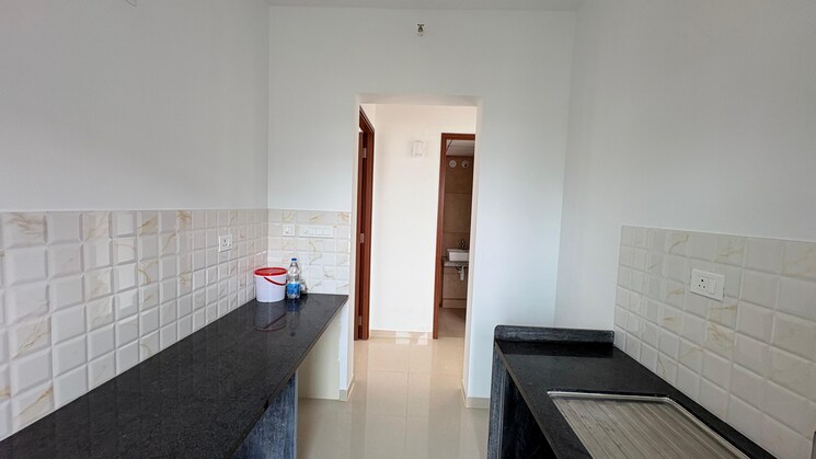 Kitchen, kalpataru-immensa 2 Bedroom 637 Sq.Ft. Apartment In Kolshet Road Thane 9030503