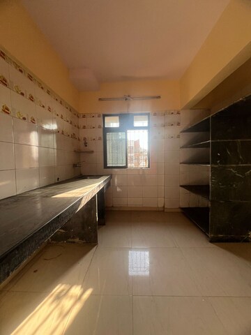Kitchen in 2 BHK Apartment at Parsik Nagar – for Sale