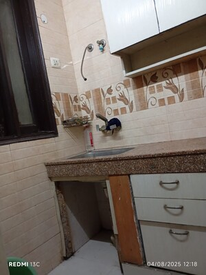 Kitchen in 2 BHK Builder Floor at Esteem Complex, Savitri Nagar – for Sale