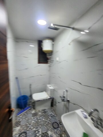 Bathroom in 1 BHK Builder Floor at Risland Sky Mansion, Chattarpur – for Sale